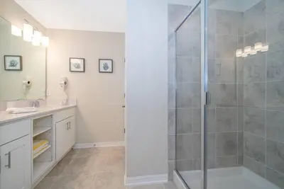 a bathroom with a shower stall and a sink at Amazing Condo Getaway in Kissimmee