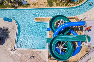 an aerial view of a water slide at a swimming pool at Amazing Condo Getaway in Kissimmee