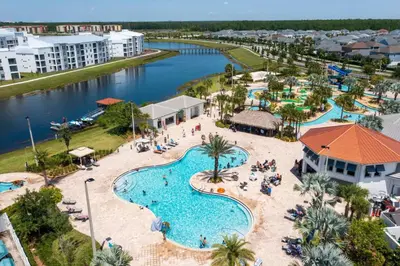 an aerial view of a pool at a resort at Amazing Condo Getaway in Kissimmee