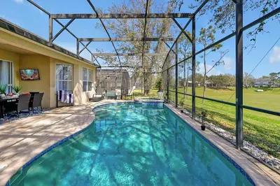 a swimming pool in the backyard of a house at Windsor Hills Family Paradise in Orlando