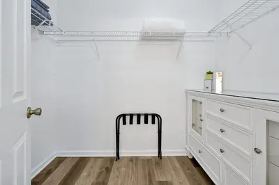a black chair in a room with a white wall at Windsor Hills Family Paradise in Orlando