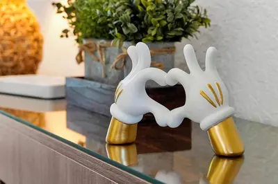 two white and goldomorphicomorphic rabbits sitting on a glass table at Windsor Hills Family Paradise in Orlando