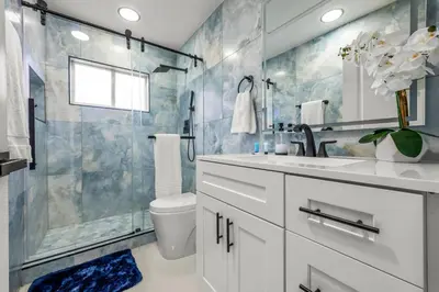 a bathroom with a shower and a sink and a toilet at Luxury Disney Retreat in Kissimmee