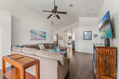 a living room with a couch and a ceiling fan at Magical Family Getaway - 10ppl in Kissimmee