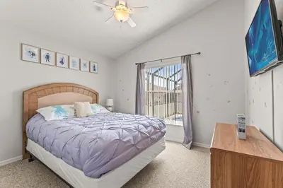 a bedroom with a bed and a window at Magical Family Getaway - 10ppl in Kissimmee