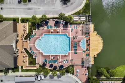 an overhead view of a swimming pool with a resort at 3 Bedroom 2 Bathroom Villas At Seven Dwarfs 25-105 in Kissimmee