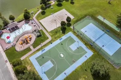 an overhead view of two tennis courts on a field at 3 Bedroom 2 Bathroom Villas At Seven Dwarfs 25-105 in Kissimmee