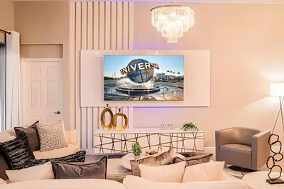 a living room with a couch and a tv at Windsor Hills 4Q c Piscina + Game Room Mario in Orlando