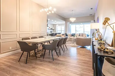 a dining room with a long table and chairs at Windsor Hills 4Q c Piscina + Game Room Mario in Orlando