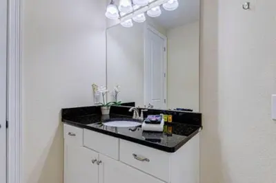 a bathroom with a sink and a mirror at ECR641 8B Stunning Dream Vacation @Encore in Orlando