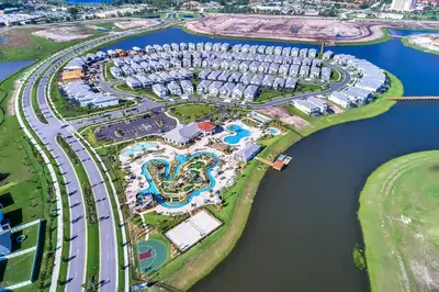 an aerial view of a resort complex next to the water at To Infinity and Beyond – Storey Lake Resort by Shine Villas condo in Kissimmee