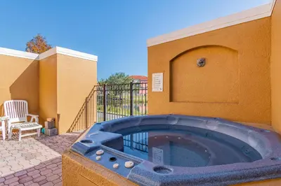 a hot tub on the side of a building at Private Hot Tub near Disney Parks in Kissimmee