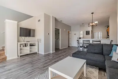 a living room with a couch and a table at Private Hot Tub near Disney Parks in Kissimmee