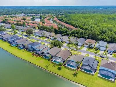 an aerial view of a row of houses next to the water at Private Heated Pool near Disney in Kissimmee