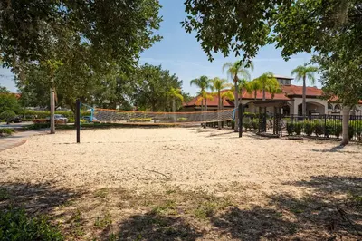 a volleyball court in a park with a volleyball net at Family Villa w Pool · 20min Disney in Kissimmee