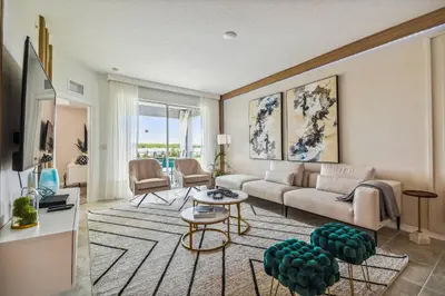 a living room with a couch and a table at Luxury Resort · Pool Lazy River in Kissimmee