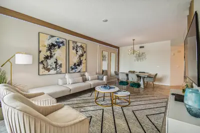 a living room with a couch and a table at Luxury Resort · Pool Lazy River in Kissimmee