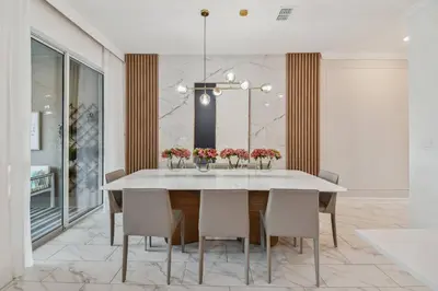 a dining room with a white table and chairs at Disney Retreat · Pool Themed Bedrooms in Kissimmee