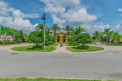 a house with a street light in front of a road at Disney Retreat – 15min to Parks in Kissimmee