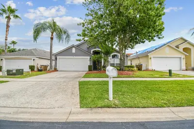 a parking meter in front of a house at Family Retreat near Disney in Kissimmee