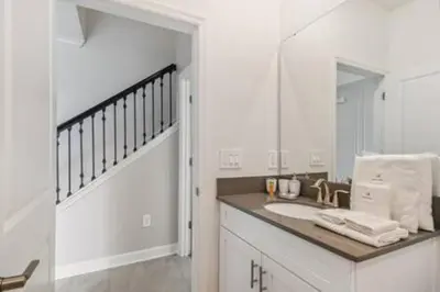 a bathroom with a sink and a mirror at Family Retreat near Disney in Kissimmee