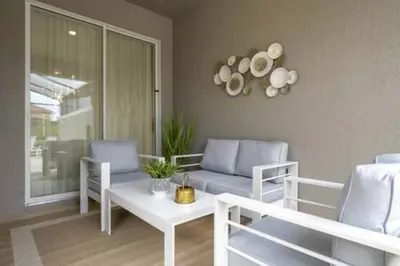 a living room with a couch and a table at Family Retreat near Disney in Kissimmee