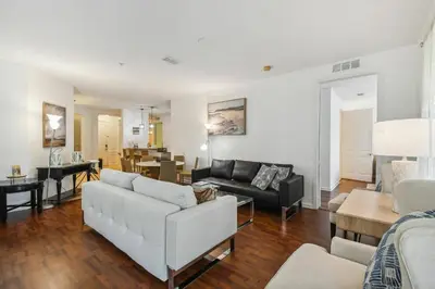 a living room with a couch and a table at Orlando Stay Near Universal Studios in Orlando