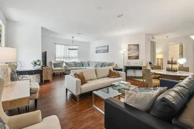 a living room with a couch and a table at Orlando Stay Near Universal Studios in Orlando