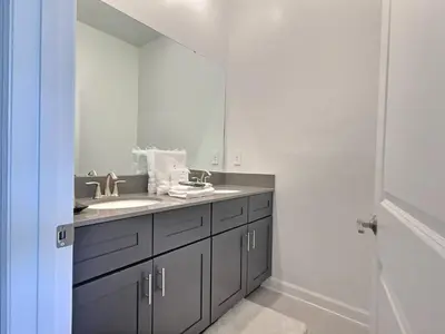 a bathroom with a sink and a mirror at Orlando Luxury Stay Near Disney Parks in Kissimmee