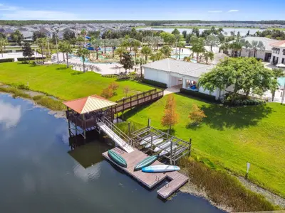 an aerial view of a house with a dock at Orlando Stay Near Disney with Private Pool in Kissimmee