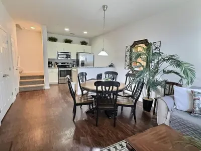 a dining room and kitchen with a table and chairs at Family Getaway Near Disney Parks in Kissimmee