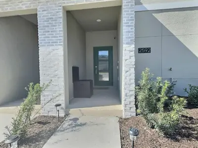 a front door of a house with a sign on it at Luxury Home Near Disney Orlando in Kissimmee