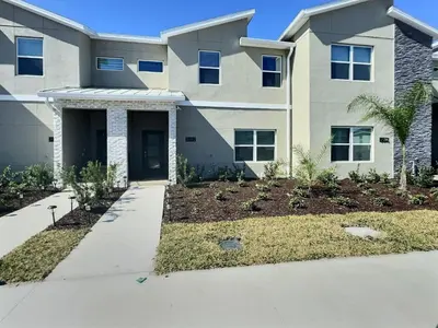 a house with a driveway in front of it at Luxury Home Near Disney Orlando in Kissimmee