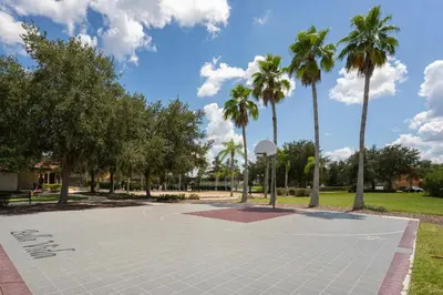a basketball court in a park with palm trees at Family Townhome w Private Pool Orlando in Kissimmee