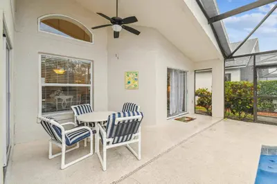 a dining room with a table and chairs and a ceiling fan at 4BR Home Game Room in Lake Berkley in Kissimmee