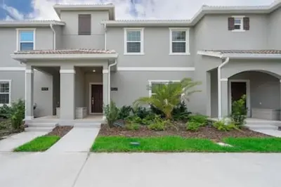 a large white house with at Family Villa · Near Disney · Sleeps 10 in Kissimmee