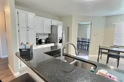 a kitchen with a sink and a counter top at Montego Bay Retreat w Pool in Kissimmee