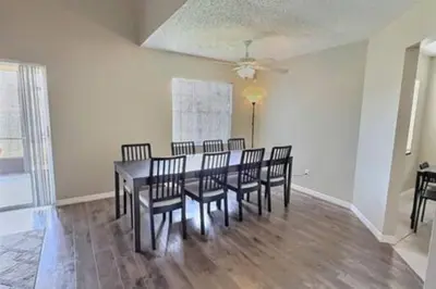 a dining room with a table and chairs at Montego Bay Retreat w Pool in Kissimmee