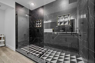 a black bathroom with a black and white checkered floor at Vista Cay Getaway · Orlando Stay in Orlando