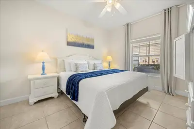 a white bedroom with a bed and a window at Orlando Family Stay · Pool Clubhouse in Kissimmee