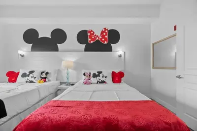a bedroom with two beds with stuffed animals on it at 2 Queen Beds Theme Park in Orlando