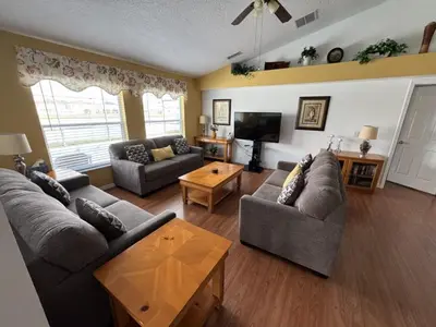a living room with two couches and a television at Cullen Villa home in Kissimmee