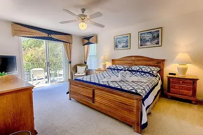 a bedroom with a bed and a tv and a window at Weikva Villa home in Kissimmee
