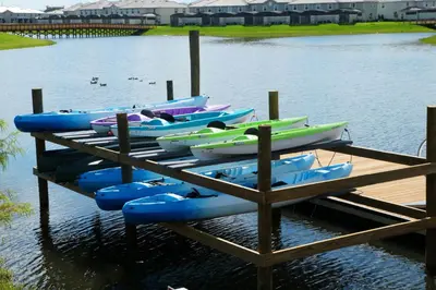 a bunch of boats are lined up on a dock at Top House with Private Pool and Resort in Kissimmee
