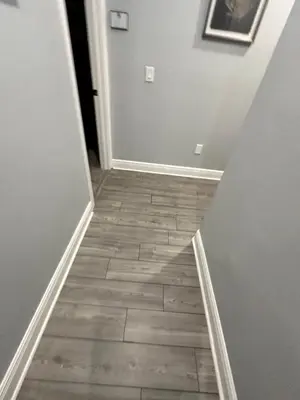 a hallway with a tile floor in a house at Wharfside Waterfront in Kissimmee