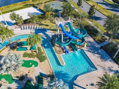 an aerial view of a water park with a water slide at 3121#308- 3BR Condo 10min Disney 2 WaterParks in Kissimmee