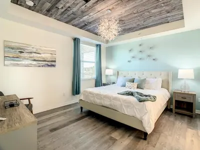 a bedroom with a bed and a wooden ceiling at 4731#201- 3BR Condo 10min Disney 2 WaterParks in Kissimmee