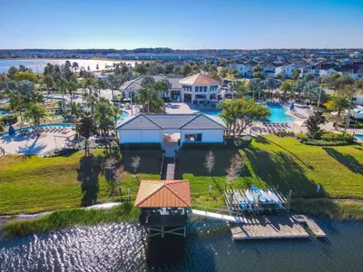 an aerial view of a house with a dock in the water at 4731#301- 3BR Condo 10min Disney 2 WaterParks in Kissimmee