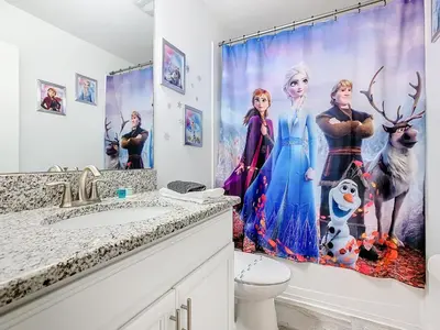 a bathroom with a frozen shower curtain in it at 4774 - 7BR w Pool 10min Disney 2 Water Parks in Kissimmee