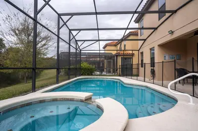 a swimming pool in a building with a building at Veranda Palms 6BR Pool Near Disney Parks in Kissimmee